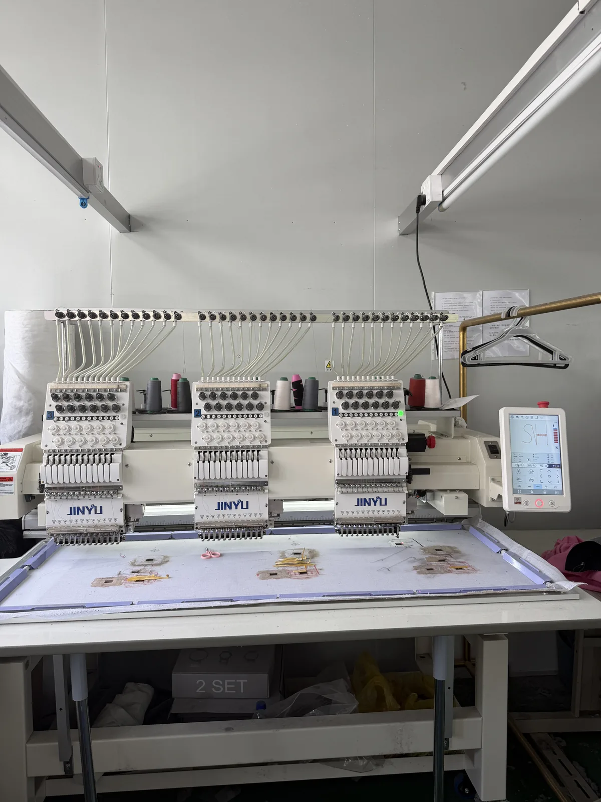 Multi-head embroidery machine at XBL Clothing